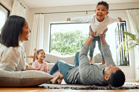 parents playing with their children at home