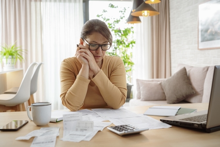 woman doing her taxes at home
